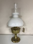 A brass Aladdin oil lamp with chimney and shade