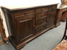 A Barker and Stonehouse mahogany sideboard fitted with cupboards and drawers, width 161 cm.