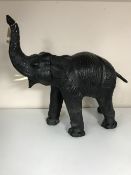 A twentieth century leather elephant CONDITION REPORT: This measures 60cm high,