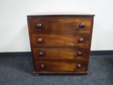 A Victorian inlaid mahogany cabinet in the form of a four drawer chest
