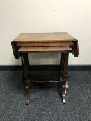 A nest of three mahogany tables with under stretchers