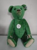 A Steiff green 1908 mohair bear, length 35 cm.