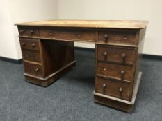 A Victorian mahogany twin pedestal desk fitted nine drawers
