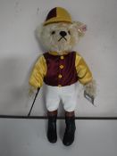 A Steiff golden mohair bear - The jockey, length 36 cm.
