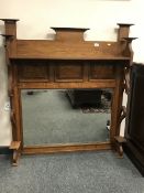 An Edwardian oak overmantel mirror,