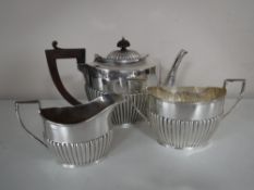 A three piece silver tea service