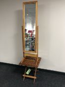 A pine cheval mirror and a teak patio occasional table