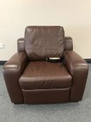 A brown button leather electric reclining armchair