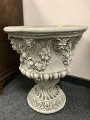 A pair of classical style composition garden urns, height 57 cm.