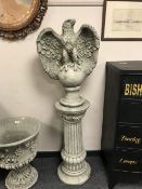 A pair of composition garden eagle statues on plinths, height 147 cm.