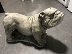 A composition garden figure of a bull dog