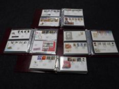 Four albums of first day covers