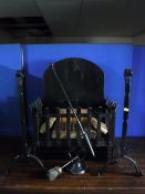 A cast iron fire grate, a pair of fire dogs,