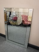 An all glass bevelled edged mirror