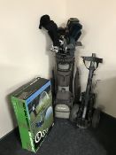 A McGregor golf bag containing assorted irons and drivers, folding golf trolley,