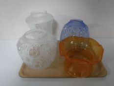 A tray containing four Victorian glass oil lamp shades