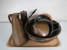 A tray of antique copper ware, twin handled pan, jug,