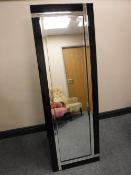 An all glass two tone cheval mirror