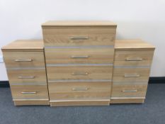 A beech effect four drawer chest and a pair of bedside chests