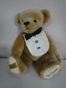 A Merrythought golden mohair bear - Signed David Emanuel, length 35 cm.