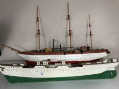 Two un-finished model wooden boats with accessories