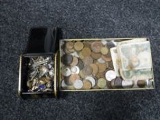 A tin of assorted foreign coins and bank notes, small jewellery box of silver bangle, fob,