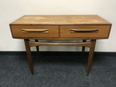 A teak G Plan side table fitted two drawers