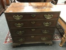 George III mahogany chest of four drawers raised on bracket feet, width 75 cm.