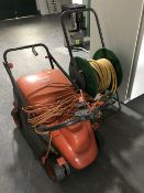 A Flymo compact 330 mower and hose on reel