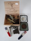 A cigar box containing military hat pin, plated lapel rose holder, tin of micro weights,