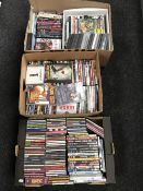 Three boxes of assorted DVD's and CD's