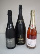 A Freixenet 150 cl bottle of Cava, together with two smaller bottles of Cava.