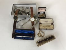 A box of assorted watches, rolled gold watch, 9ct bar brooch,