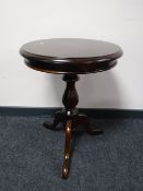 A mahogany pedestal occasional table