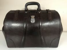 A leather Gladstone bag