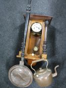 An antique copper kettle together with bed warming pan and mahogany wall clock