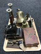 A tray of two brass ships bells, morse code tapper, pair of oak and plated candlesticks,