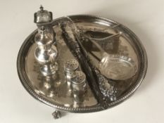 A silver plated card tray together with a collection of silver items including salt and pepper pots,