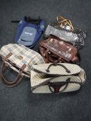 A box of bags including a holdall signed Gucci