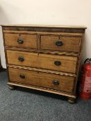 A George III provincial oak chest of four drawers,