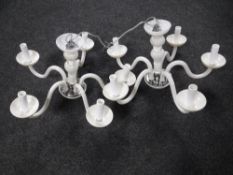 A pair of Italian glass five branch chandeliers
