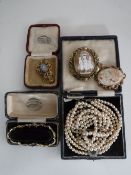 Two cameo brooches together with an ornate brooch,