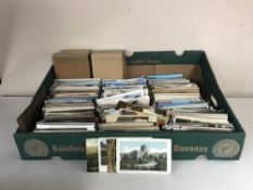 A box of early twentieth century and later postcards