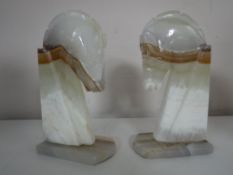 A pair of onyx horse head bookends