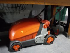 A Flymo lawn rake compact 3400