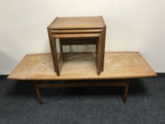 A nest of three teak G Plan tables and a teak coffee table