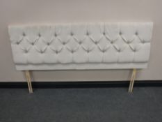 A 6' headboard upholstered in a button fabric
