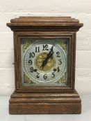 An oak cased American Ansonia mantel clock