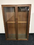 A teak double door bookcase