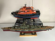 A boxed plastic modelling kit - HMCS Snowberry together with a built modelling kit - Tirpitz and